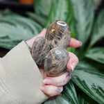 Load image into Gallery viewer, Black/Peach Moonstone Palm Stones - Intuitively Chosen
