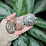 Load image into Gallery viewer, Black/Peach Moonstone Palm Stones - Intuitively Chosen
